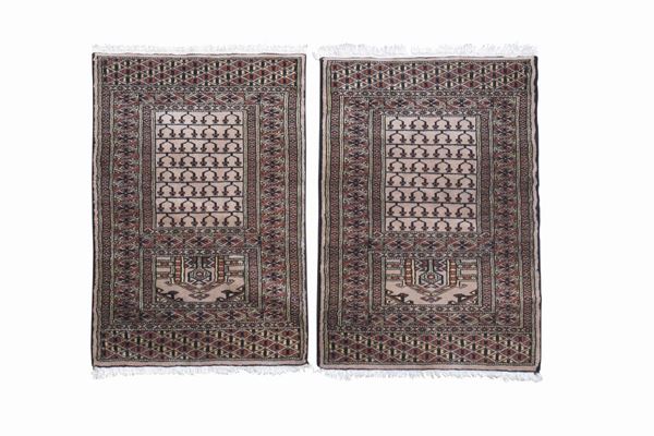 A pair of prayer rugs