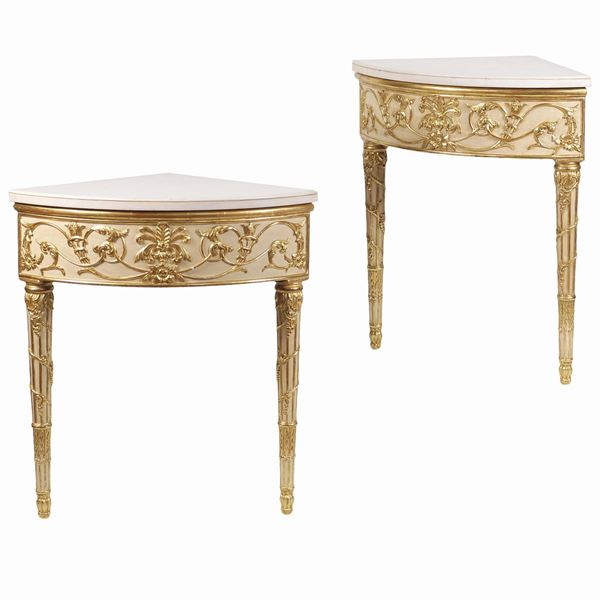 A pair of Louis XVI style consoles