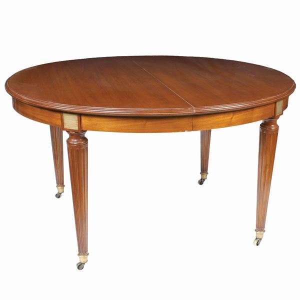 A prolongable mahogany table