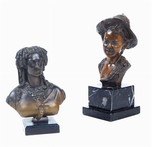 A pair of bronze busts