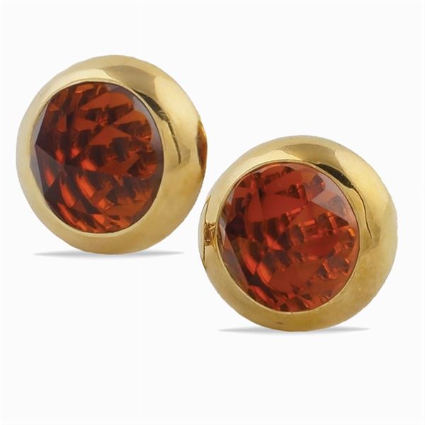 A pair of Pomellato 18K gold and garnet earclips