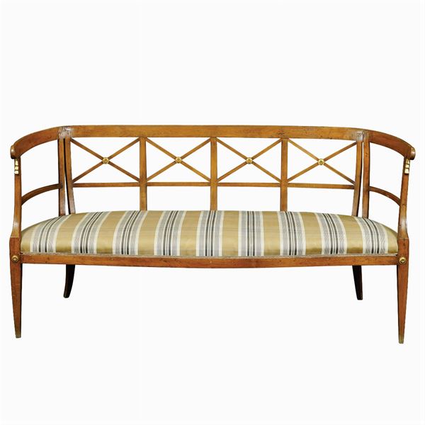 A three seat beachwood sofa