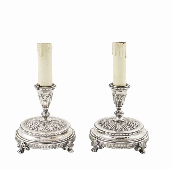 A pair of silver 800 electrified candlesticks