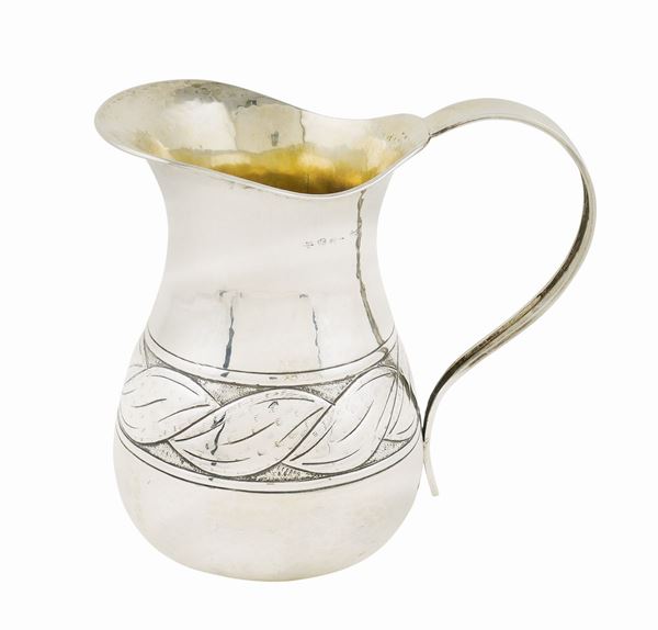 An 800 silver hammered jug