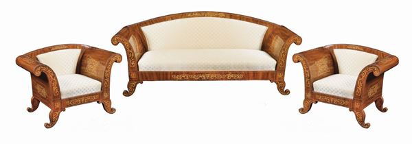 A Charles X mahogany sofa and two armchairs