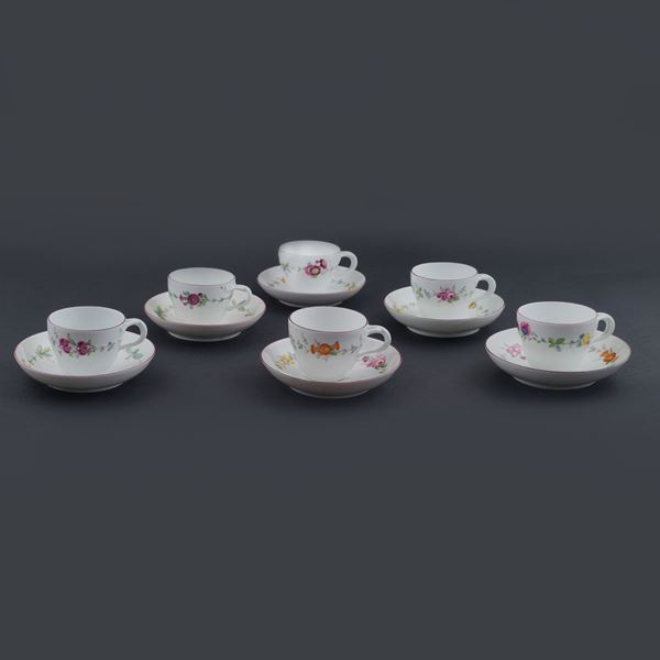 A lot of Meissen coffee cups with plates
