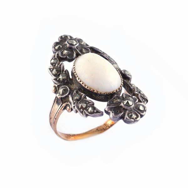 A pink gold and silver ring