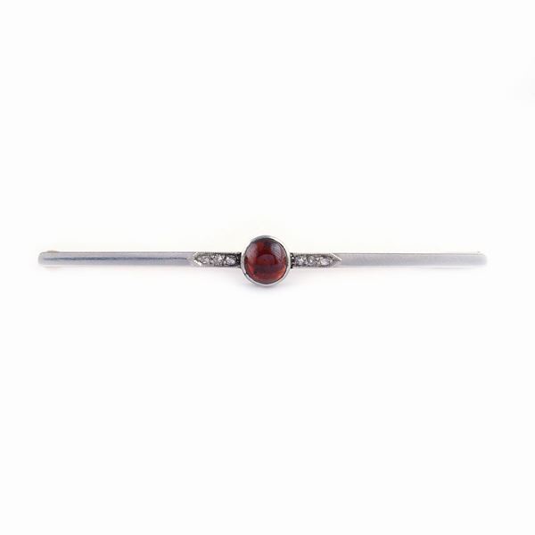 A white gold and gold bar brooch