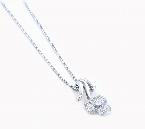 An 18kt white gold floral-shaped pendant