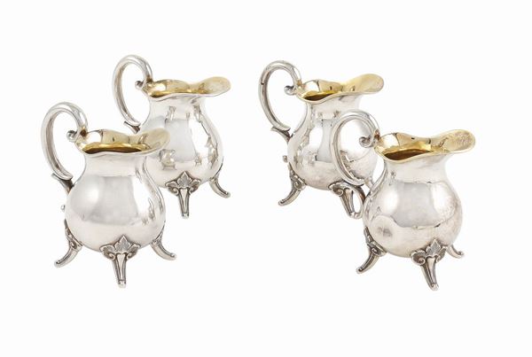 Four 800 silver milk jugs