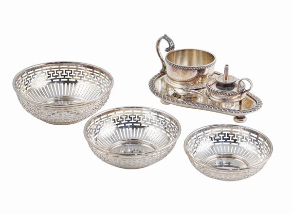 Three silverplate baskets and a oil lamp