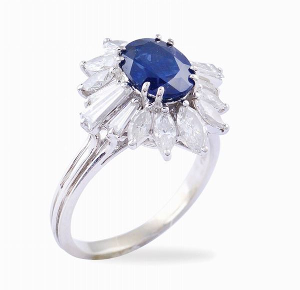An 18kt white gold ring with a natural sapphire
