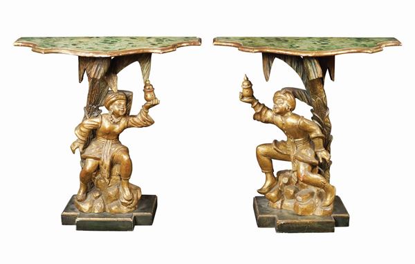 A pair of giltwood consoles