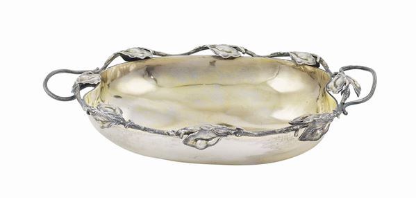 A silver centerpiece with two handles