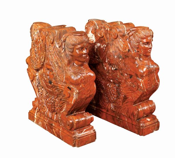 A pair of red marble bases