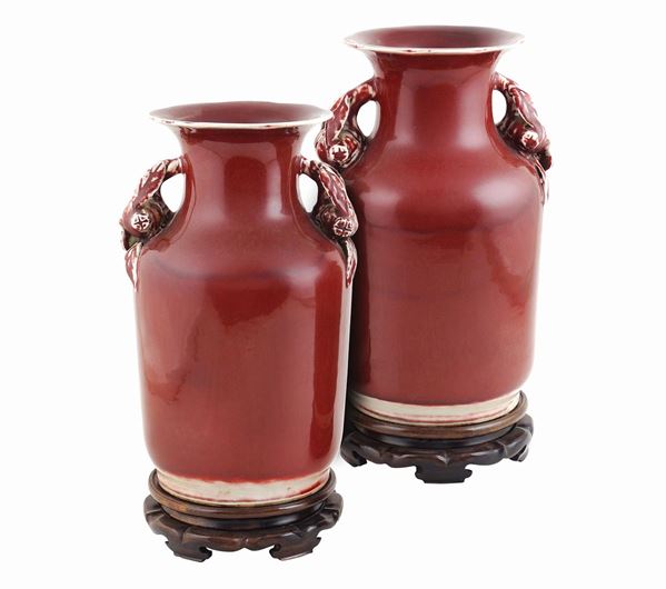A pair of ceramic red vases