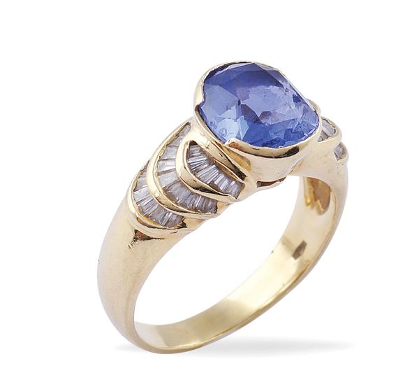 An 18kt gold ring with sapphire and diamonds