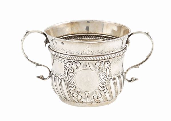 A silver porridge cup with two handles