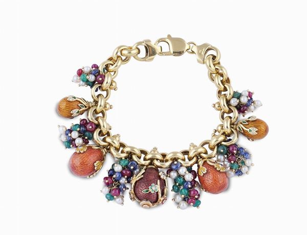 Bracciale in oro giallo 18kt e charms