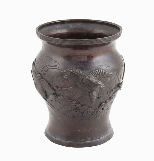 A bronze baluster shaped vase