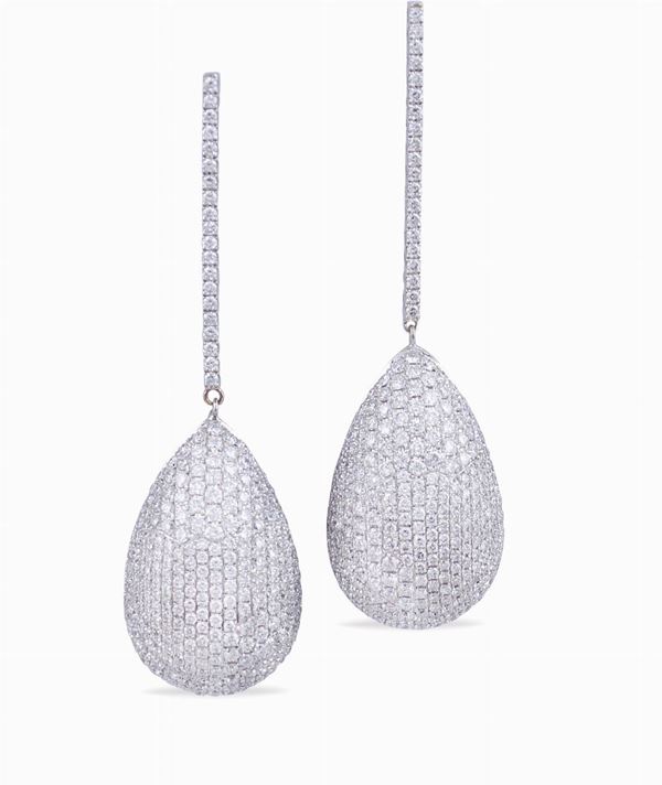 A pair of 18kt white gold pendant earrings with diamonds