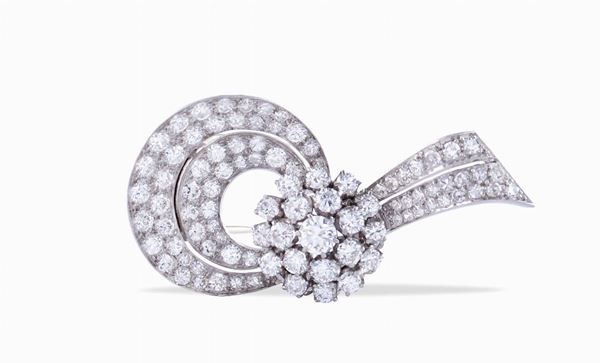 A platinum brooch with floral-shaped diamonds