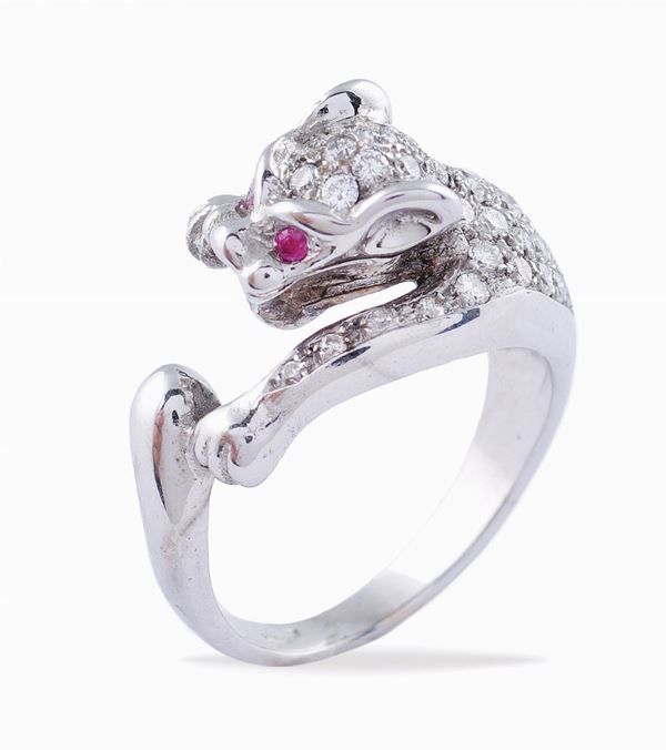 An 18kt white gold panther shaped ring and diamonds