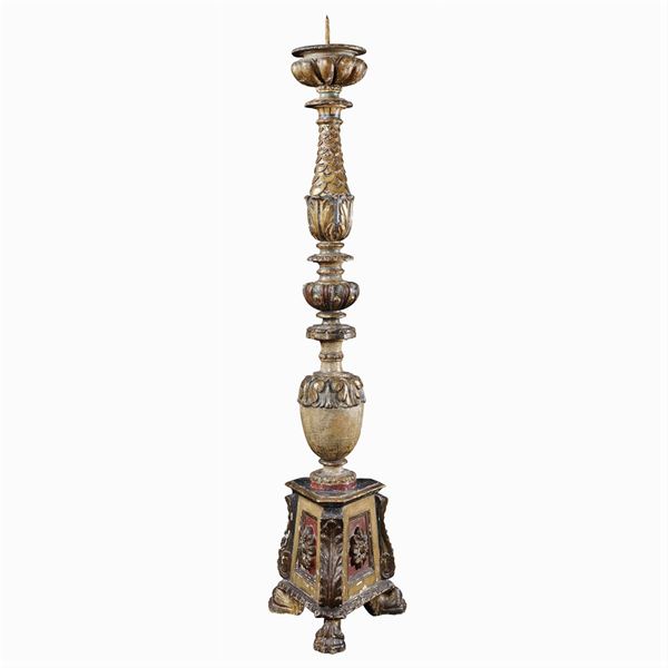 An antique lacquered and giltwood torch holder