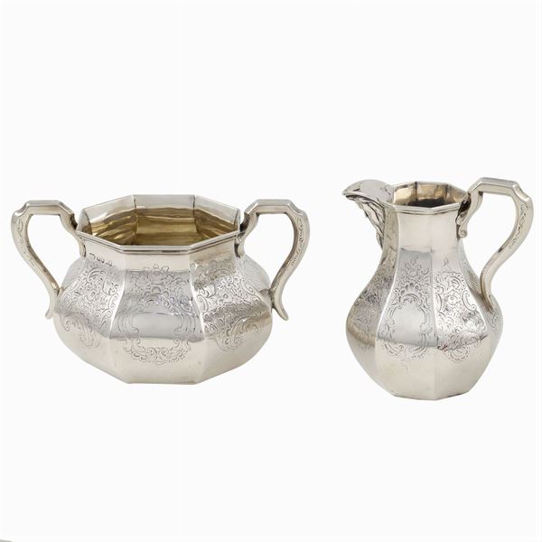 A silver coffeepot and sugar bowl