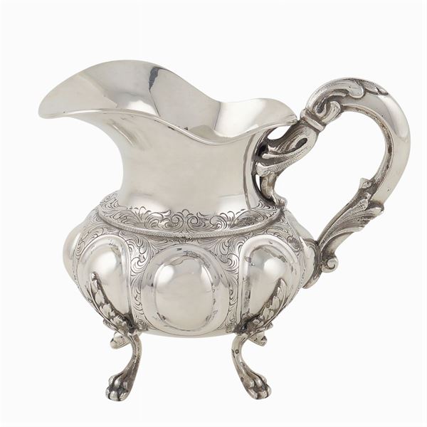 A silver milk jug