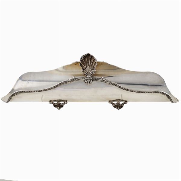 A silver breadstick holder