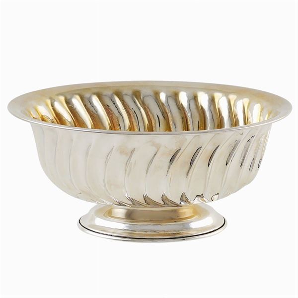 An oval silver centerpiece