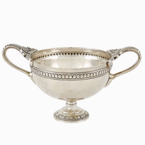 A silver cup with two handles