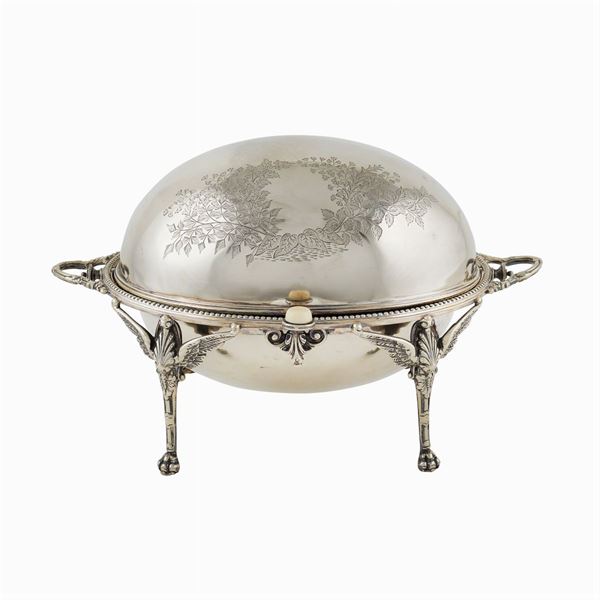 A silverplated metal revolving dish