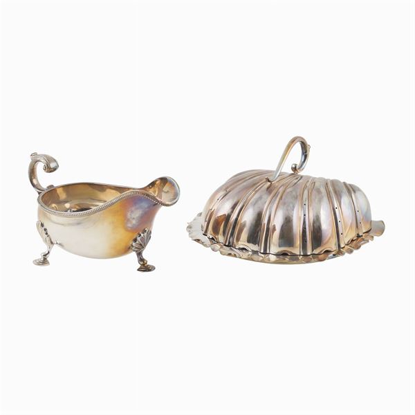 A silverplated metal sauce boat and a cheese holder