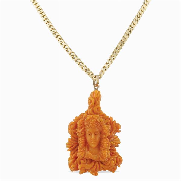 A coral sculpted pendant