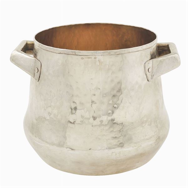 A hammered silver pot