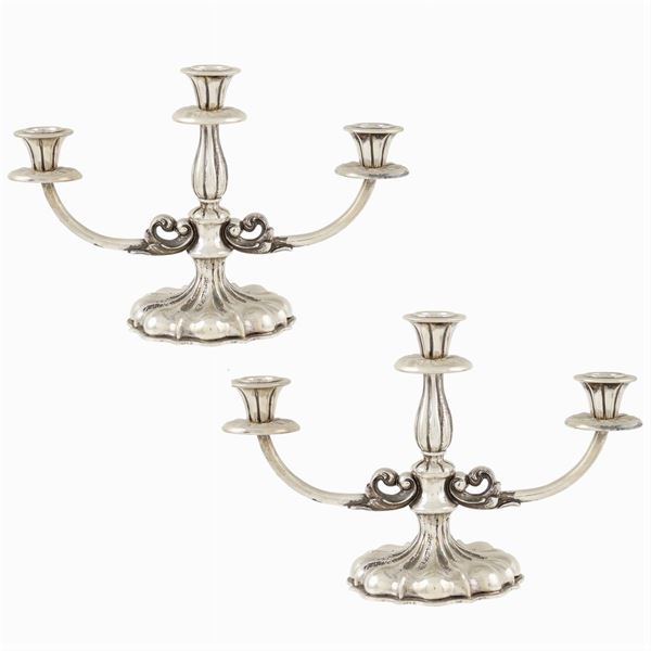 A pair of silver candelabra