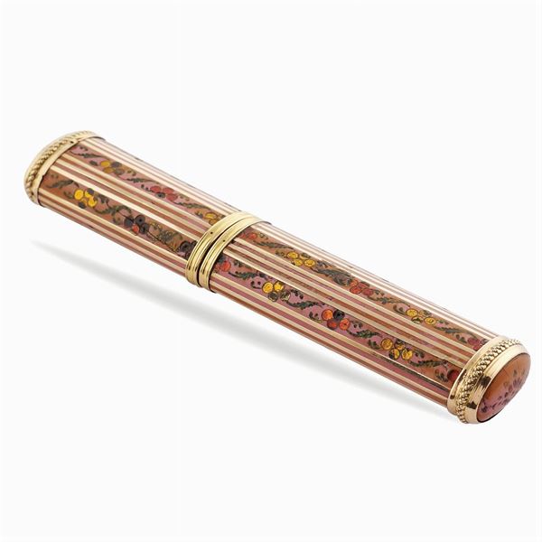 A gold and enamel needle holder