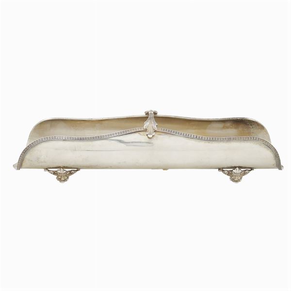 A silver breadstick holder