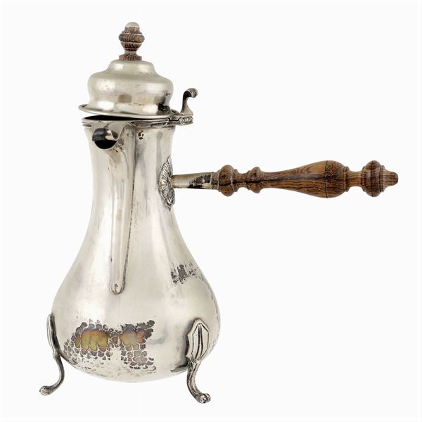 A silver chocolate kettle