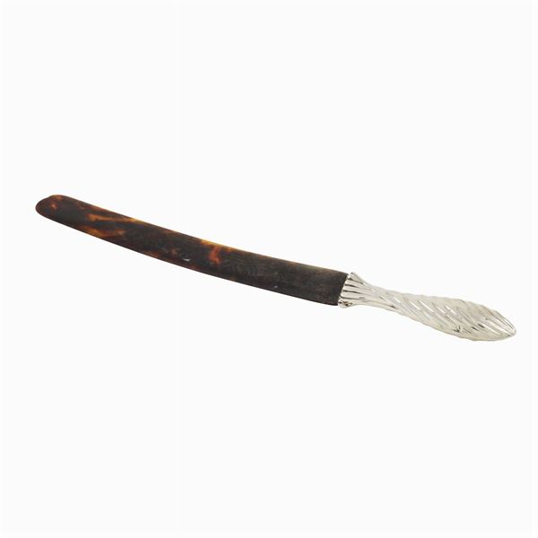 A tortoise paper knife with silver handles