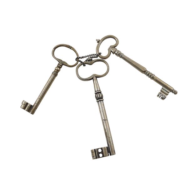 Three antique silver keys
