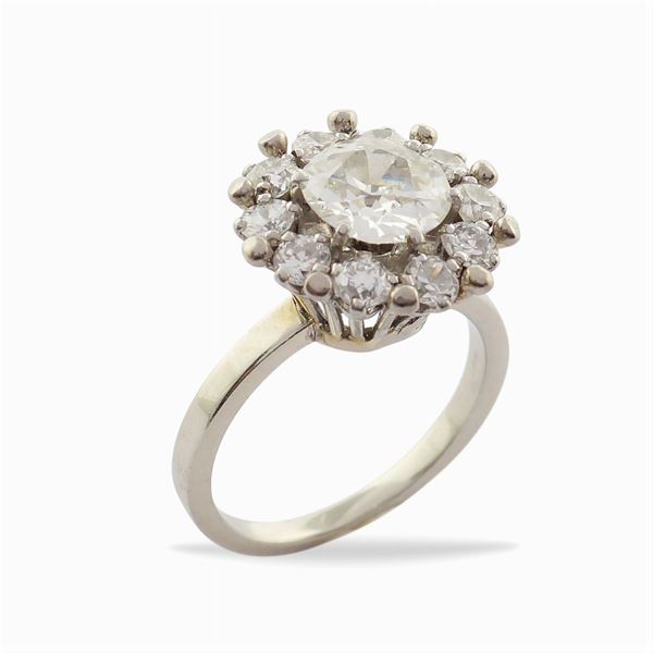 A white gold ring with a diamond