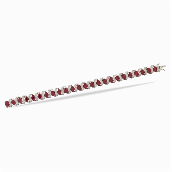 An 18kt white gold bracelet with oval rubies
