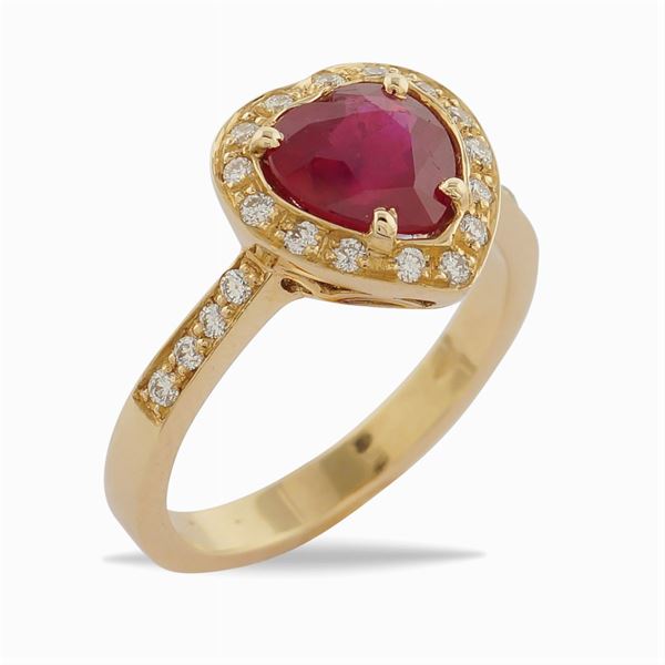 An 18kt pink gold ring with a ruby
