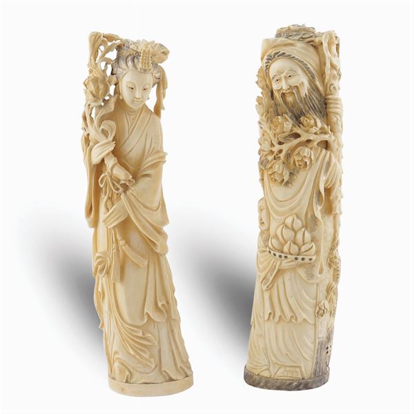 A pair of figures in bone