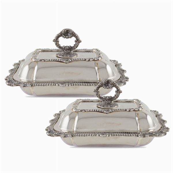 A pair of silver plated metal vegetable plates