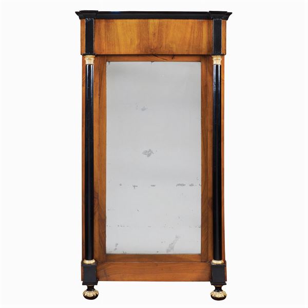 A walnut Empire style wall mirror