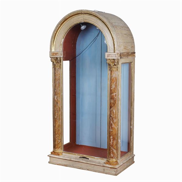 An Empire style lacquered and gilt wood showcase